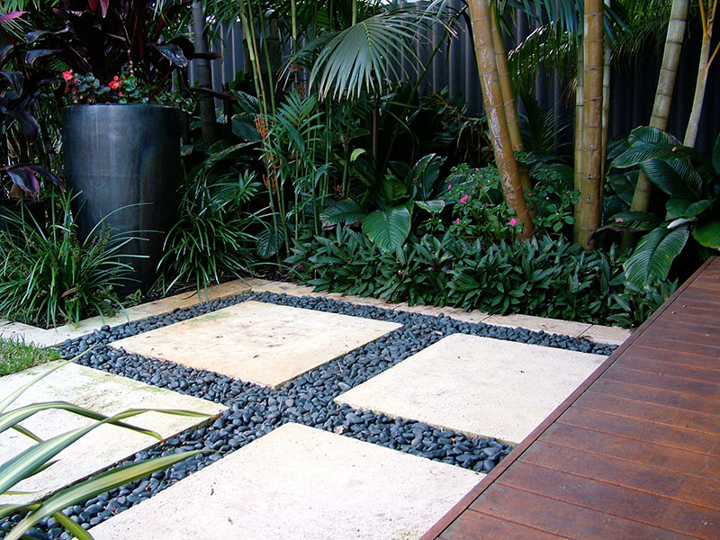 Pavers and pebbles in tropical garden nedlands
