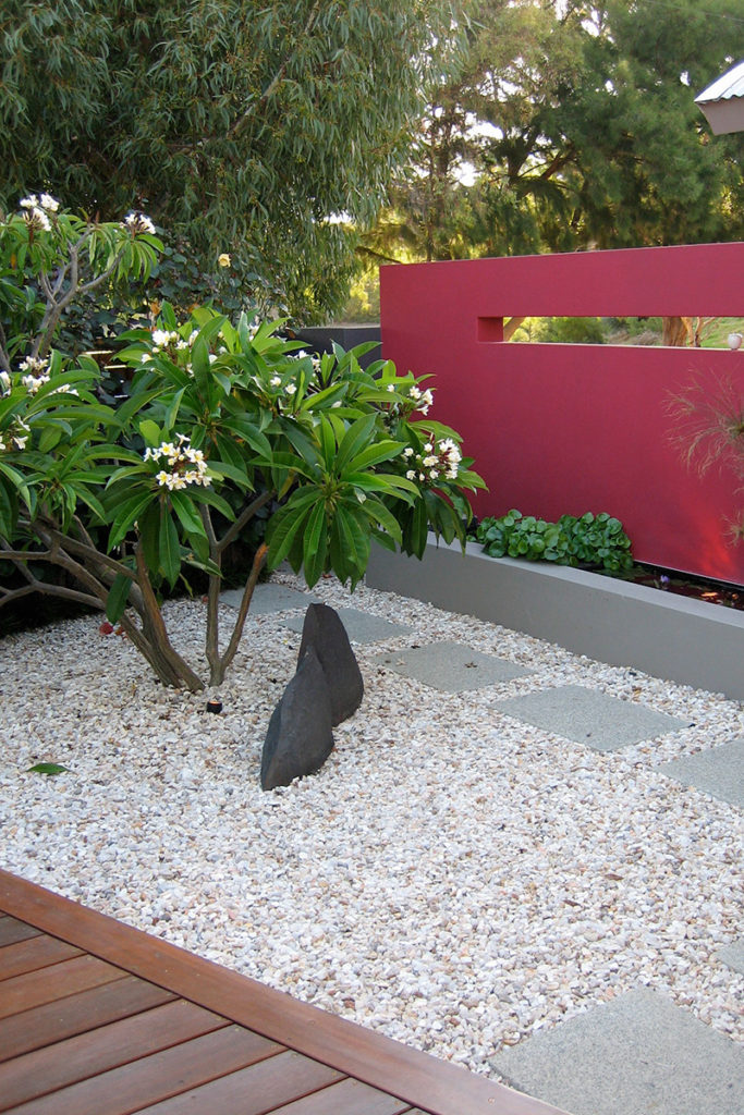 rock sculpture in gravel garden