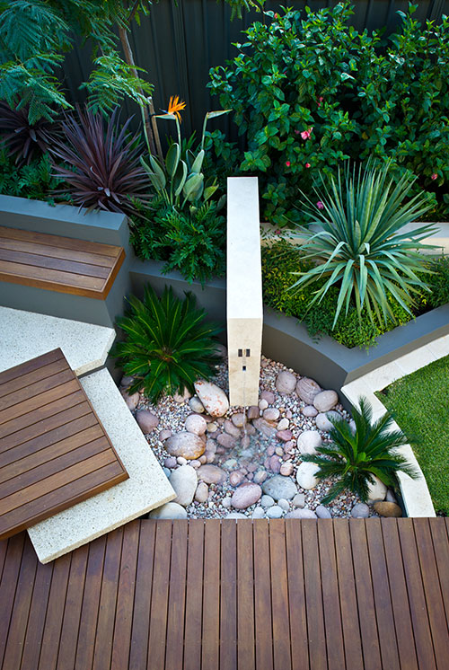 garden feature with water and pebbles