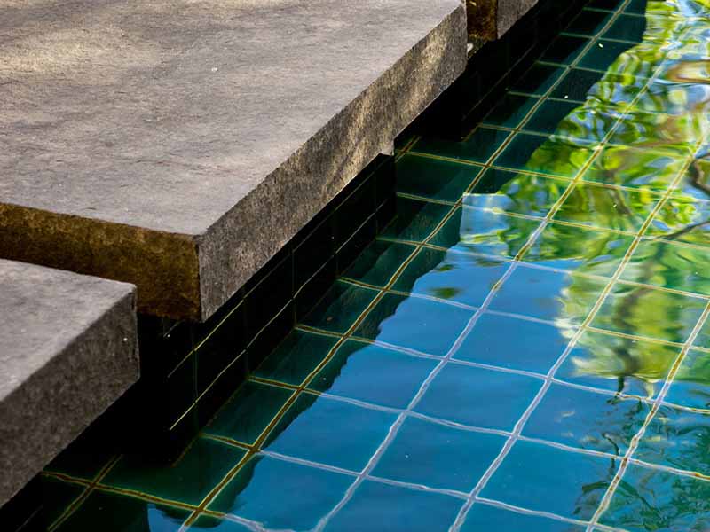 pond detail with granite steppers and tiles