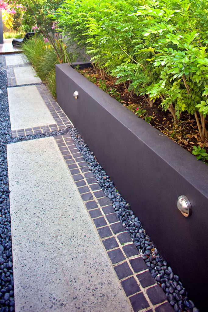 walkway with exposed aggregate and granite cobbles