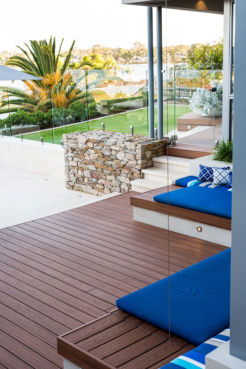 garden design with stone wall and daybeds overlooking swan river